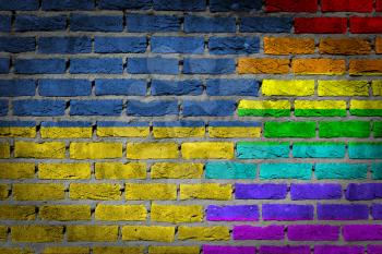 Dark brick wall texture - coutry flag and rainbow flag painted on wall - Ukraine