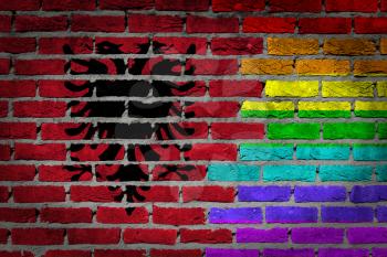 Dark brick wall texture - coutry flag and rainbow flag painted on wall - Albania