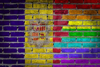 Dark brick wall texture - coutry flag and rainbow flag painted on wall - Andorra