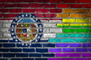Dark brick wall texture - coutry flag and rainbow flag painted on wall - Missouri