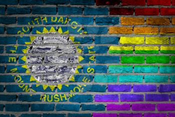 Dark brick wall texture - coutry flag and rainbow flag painted on wall - South Dakota