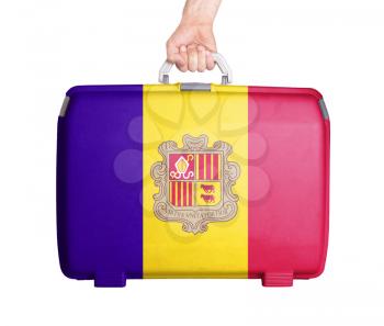 Used plastic suitcase with stains and scratches, printed with flag, Andorra