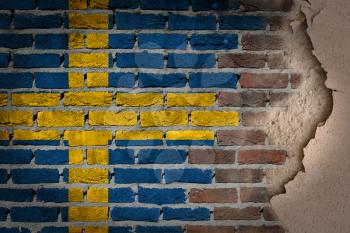 Dark brick wall texture with plaster - flag painted on wall - Sweden