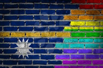 Dark brick wall texture - coutry flag and rainbow flag painted on wall - Nauru