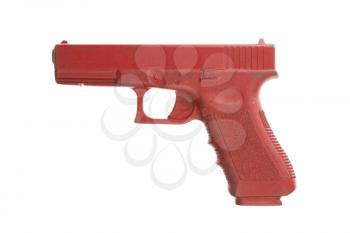 Dirty red training gun isolated on white, law enforcement