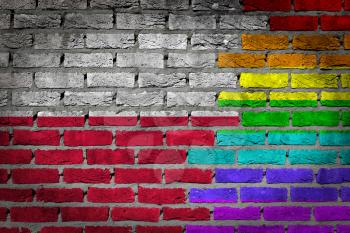 Dark brick wall texture - coutry flag and rainbow flag painted on wall - Poland