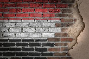Dark brick wall texture with plaster - flag painted on wall - Yemen