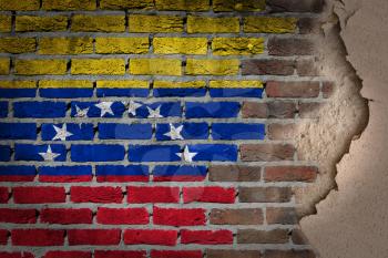 Dark brick wall texture with plaster - flag painted on wall - Venezuela