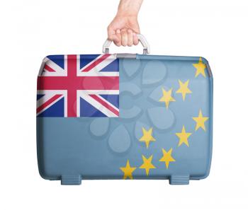 Used plastic suitcase with stains and scratches, printed with flag, Tuvalu