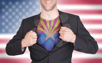 Businessman opening suit to reveal shirt with state flag (USA), Arizona