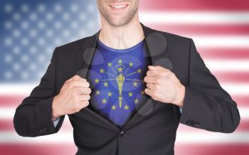 Businessman opening suit to reveal shirt with state flag (USA), Indiana