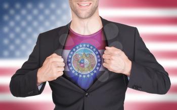 Businessman opening suit to reveal shirt with state flag (USA), Missouri