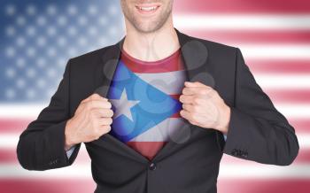 Businessman opening suit to reveal shirt with state flag (USA), Puerto Rico