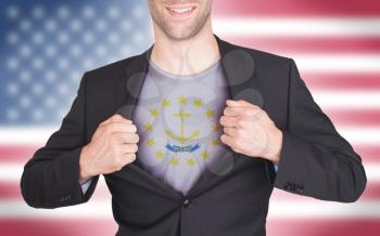 Businessman opening suit to reveal shirt with state flag (USA), Rhode Island