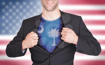 Businessman opening suit to reveal shirt with state flag (USA), South Carolina