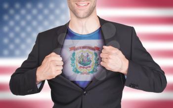 Businessman opening suit to reveal shirt with state flag (USA), West Virginia