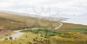 Highlands of Scotland narrow road in mountain landscape - United Kingdom