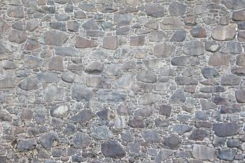 Antique natural stonewall, old stones in different sizes
