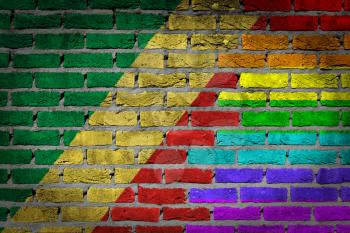 Dark brick wall texture - coutry flag and rainbow flag painted on wall - Congo