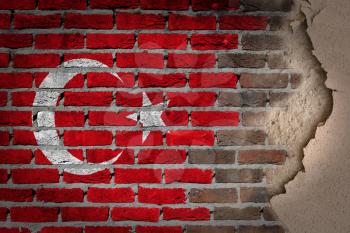 Dark brick wall texture with plaster - flag painted on wall - Turkey
