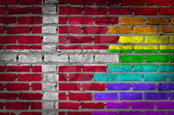 Dark brick wall texture - coutry flag and rainbow flag painted on wall - Denmark