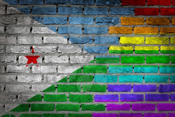 Dark brick wall texture - coutry flag and rainbow flag painted on wall - Djibouti