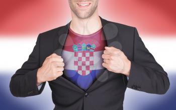 Businessman opening suit to reveal shirt with flag, Croatia