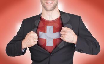 Businessman opening suit to reveal shirt with flag, Switzerland