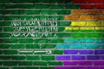 Dark brick wall texture - coutry flag and rainbow flag painted on wall - Saudi Arabia