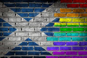 Dark brick wall texture - coutry flag and rainbow flag painted on wall - Scotland