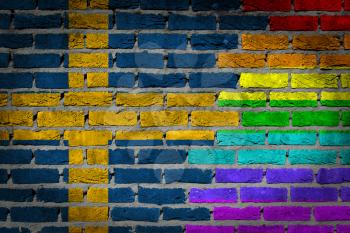 Dark brick wall texture - coutry flag and rainbow flag painted on wall - Sweden