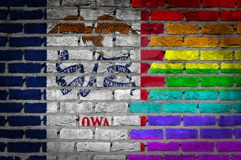 Dark brick wall texture - coutry flag and rainbow flag painted on wall - Iowa