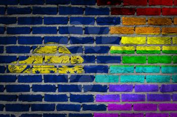 Dark brick wall texture - coutry flag and rainbow flag painted on wall - Oregon