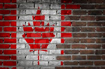 Dark brick wall texture - flag painted on wall - Canada