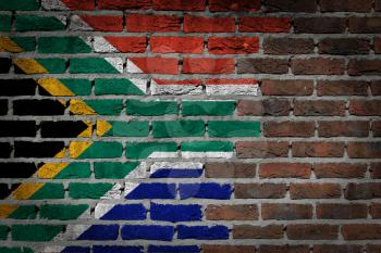 Dark brick wall texture - flag painted on wall - South Africa