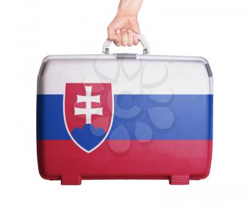 Used plastic suitcase with stains and scratches, printed with flag, Slovakia