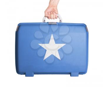 Used plastic suitcase with stains and scratches, printed with flag, Somalia
