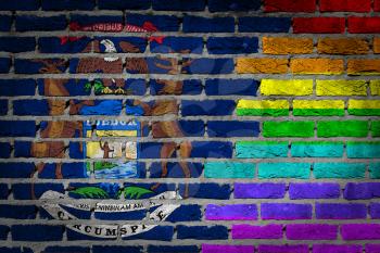 Dark brick wall texture - coutry flag and rainbow flag painted on wall - Michigan