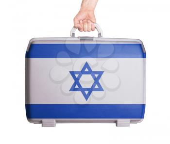 Used plastic suitcase with stains and scratches, printed with flag, Israel