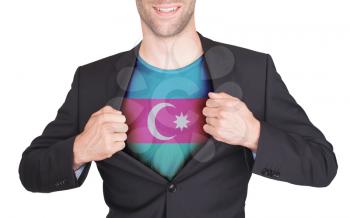 Businessman opening suit to reveal shirt with flag, Azerbaijan