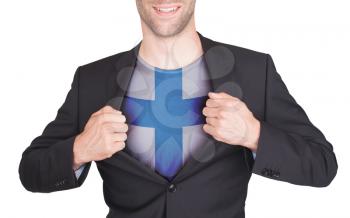 Businessman opening suit to reveal shirt with flag, Finland