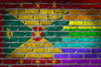 Dark brick wall texture - coutry flag and rainbow flag painted on wall - Grenada