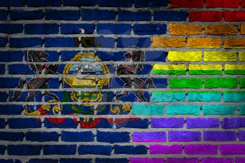 Dark brick wall texture - coutry flag and rainbow flag painted on wall - Pennsylvania