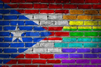 Dark brick wall texture - coutry flag and rainbow flag painted on wall - Puerto Rico
