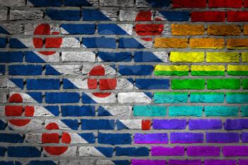 Dark brick wall texture - coutry flag and rainbow flag painted on wall - Friesland
