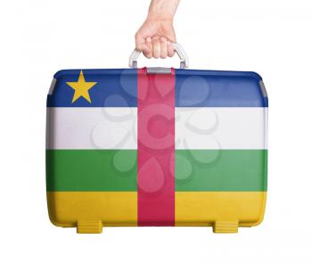 Used plastic suitcase with stains and scratches, printed with flag, Central African Republic