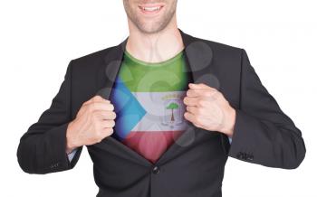 Businessman opening suit to reveal shirt with flag, Equatorial Guinea