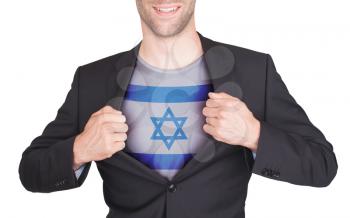 Businessman opening suit to reveal shirt with flag, Israel