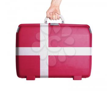 Used plastic suitcase with stains and scratches, printed with flag, Denmark