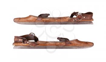 Old wooden ice skates isolated on white